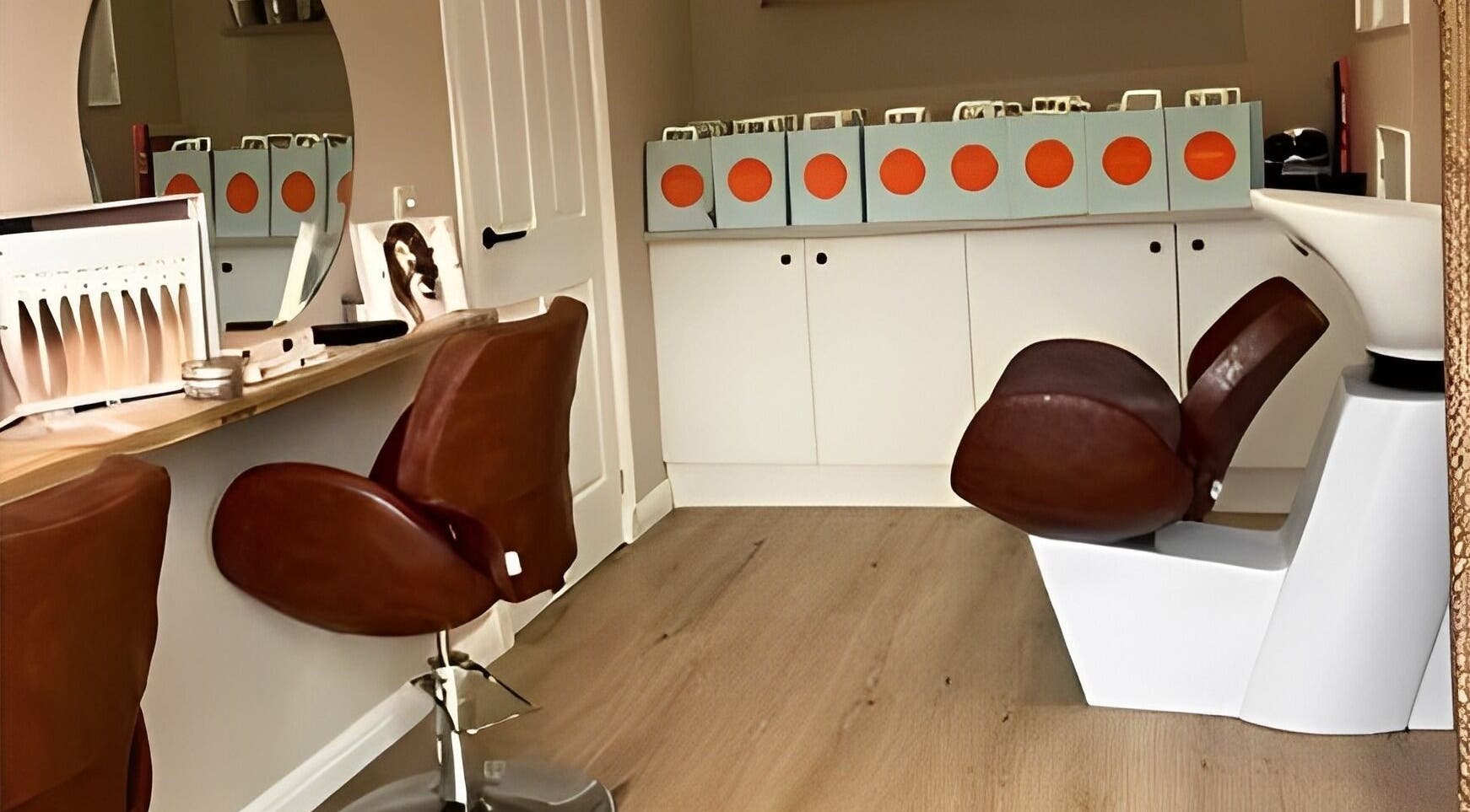 Elegant salon chairs at Riona Hair Studio, Glasgow, Scotland, GB, showcasing modern design and comfort.