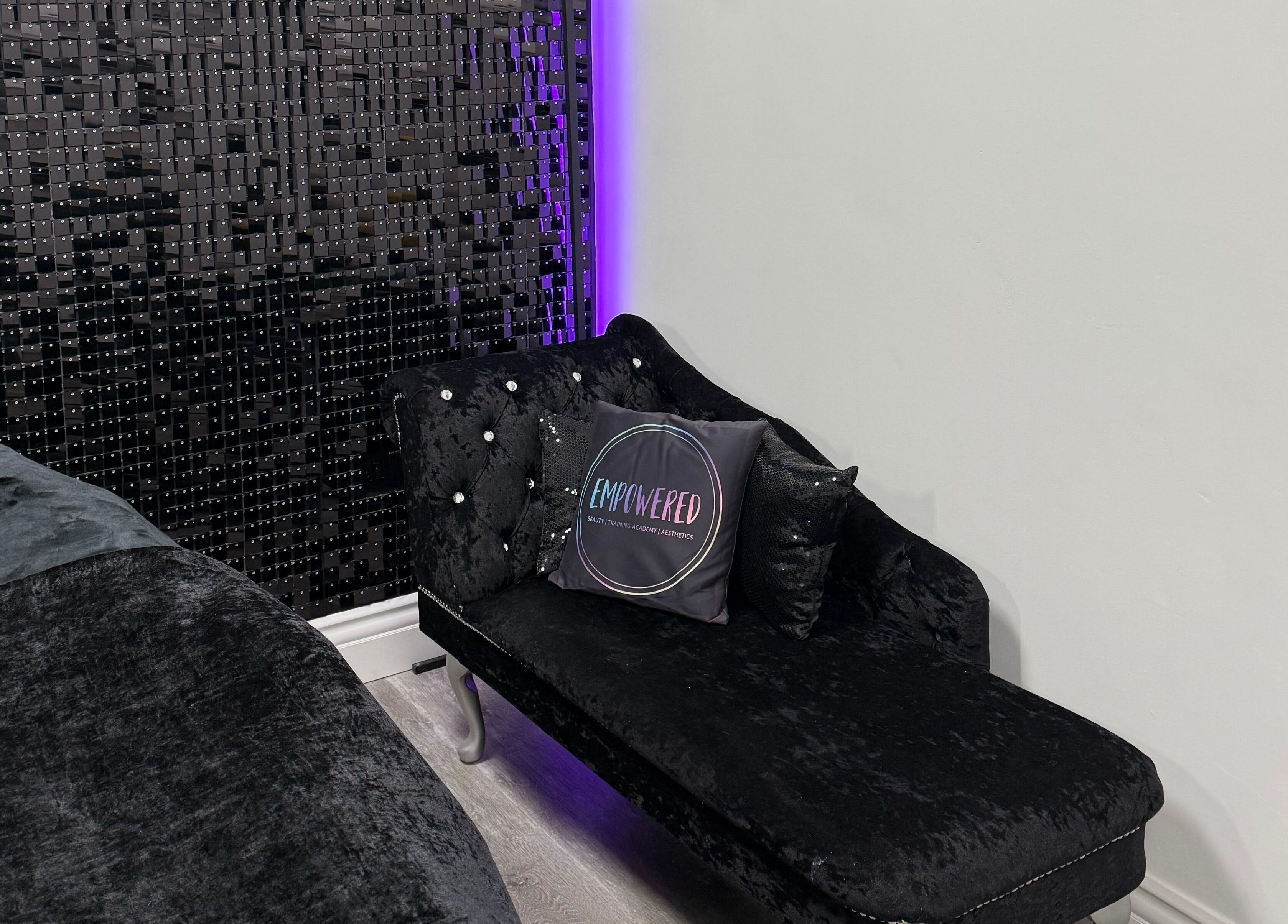 Elegant lounge with chic black seating at Empowered Beauty and Training Academy, Thornton-cleveleys, England, GB.
