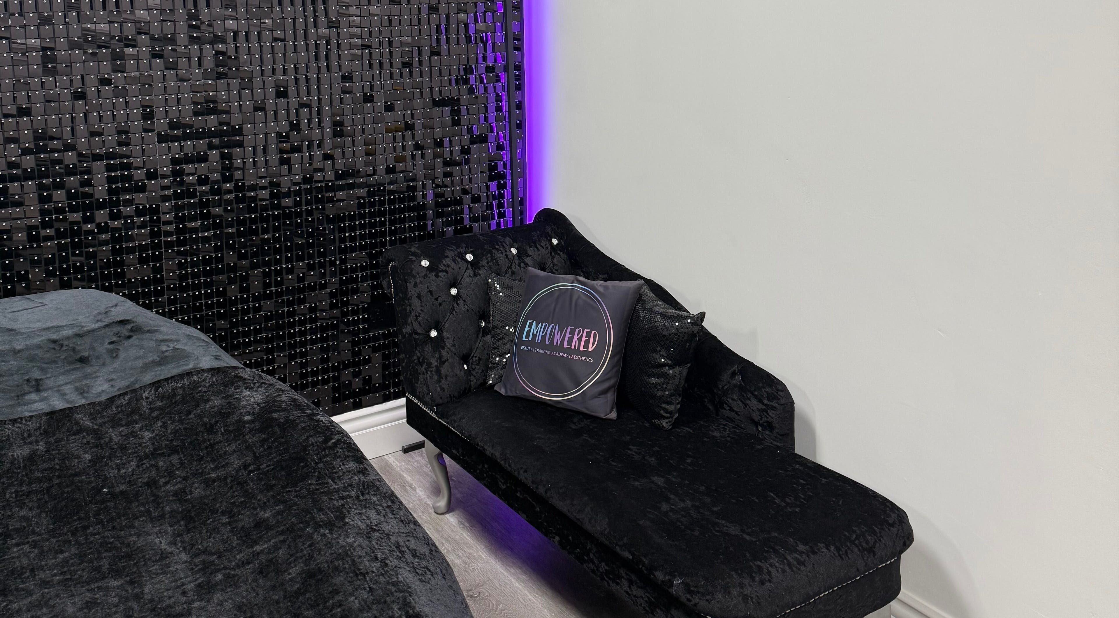Elegant lounge with chic black seating at Empowered Beauty and Training Academy, Thornton-cleveleys, England, GB.