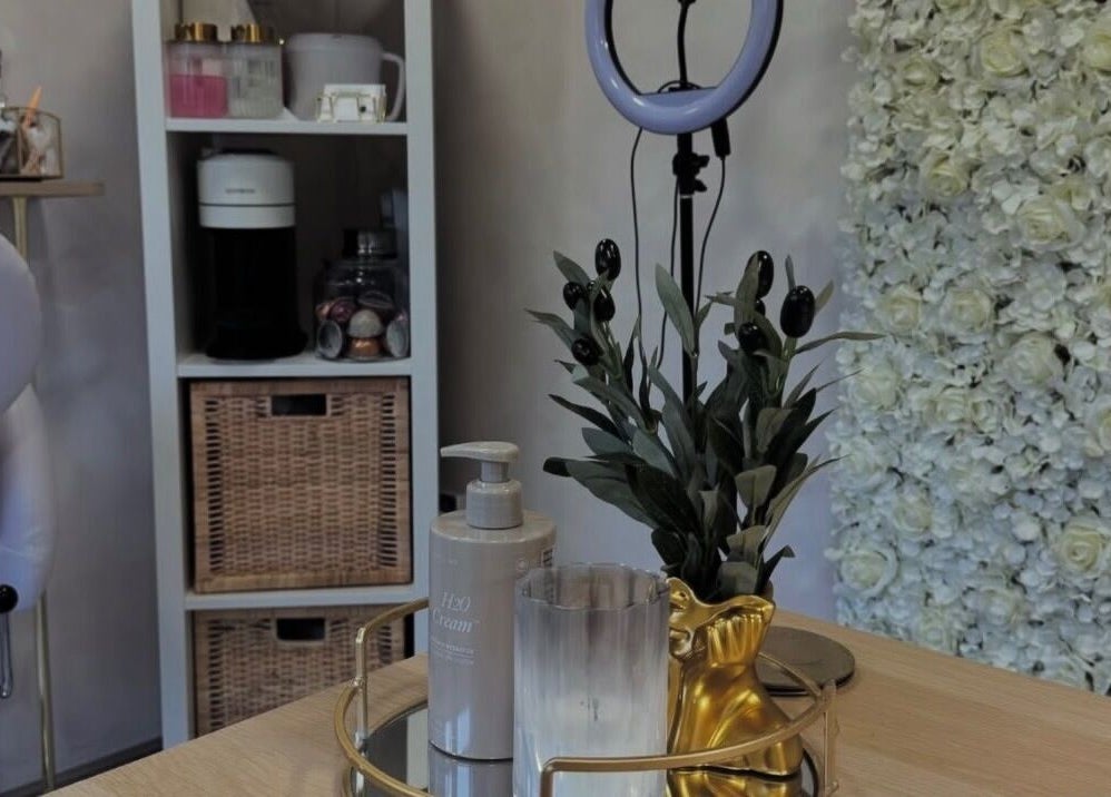 Chic beauty desk setup at Beauty by CO B, Dronfield, England, GB with floral décor and skincare products.