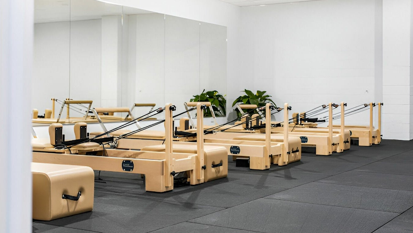 Pilates reformer studio at Complete Body, Toowoomba City, Queensland, AU showcasing modern fitness equipment.