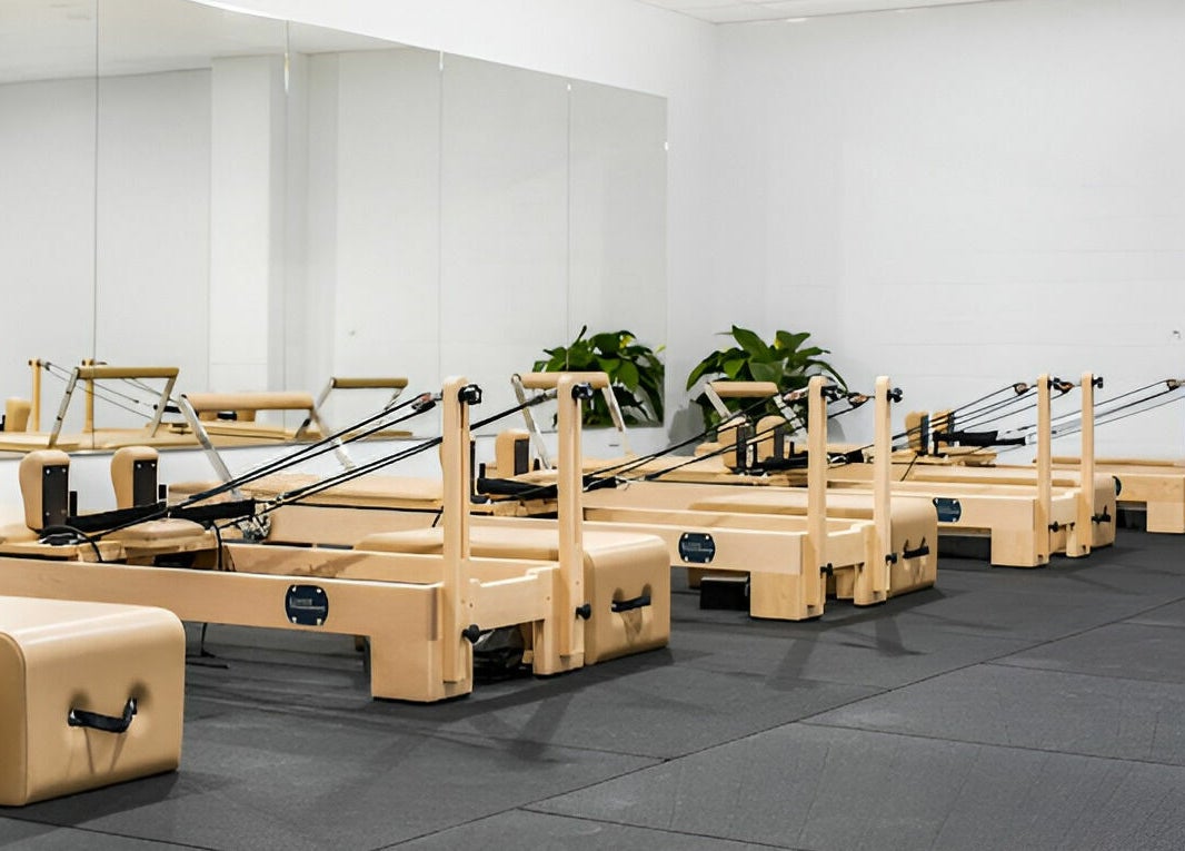 Pilates reformer studio at Complete Body, Toowoomba City, Queensland, AU showcasing modern fitness equipment.