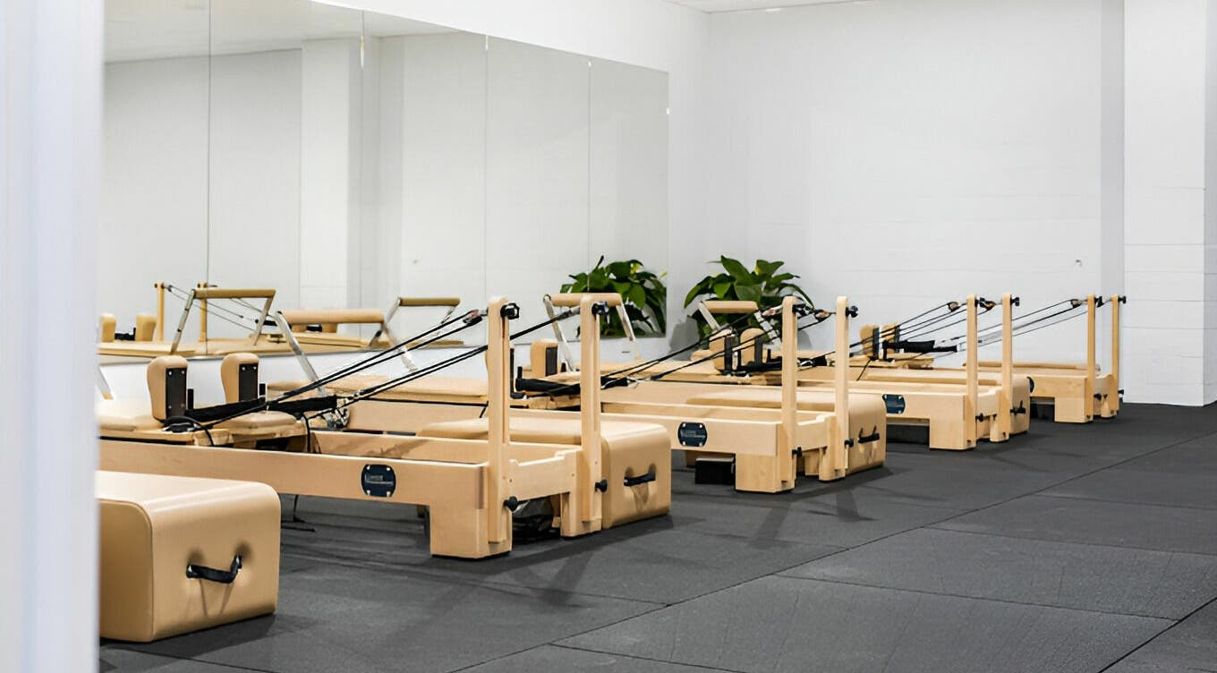 Pilates reformer studio at Complete Body, Toowoomba City, Queensland, AU showcasing modern fitness equipment.