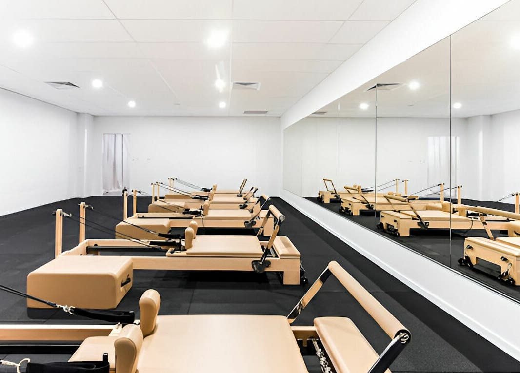 Reformer Pilates studio at Complete Body in Toowoomba City, Queensland, AU, featuring mirrored walls for classes.