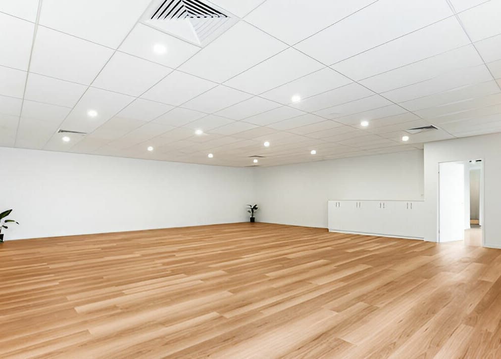 Wide open room at Complete Body, Toowoomba City, Queensland, AU, with wood floors and plants.