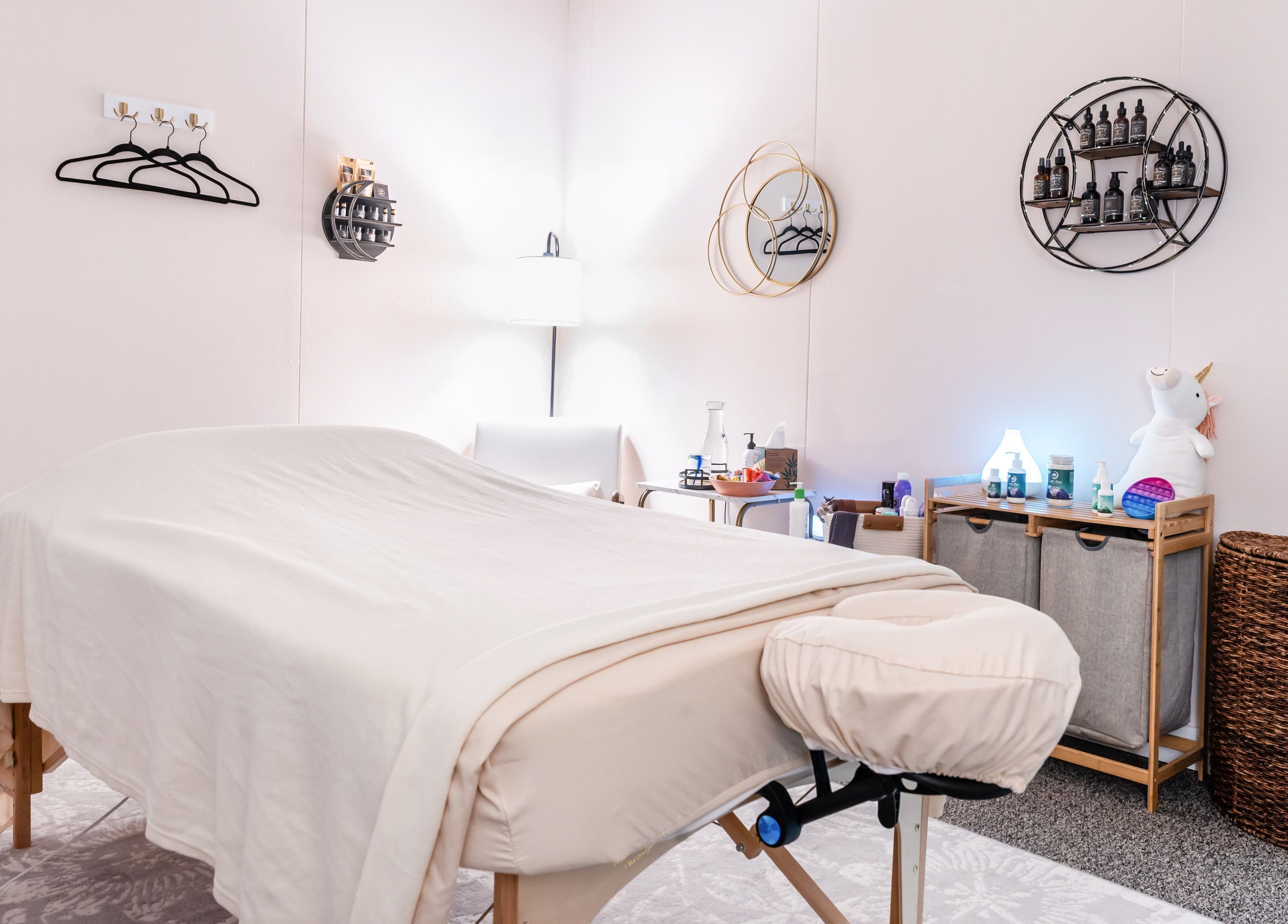 Relaxing massage room at Open Your Heart in Saline, Michigan, US with cozy decor and tranquil ambiance.