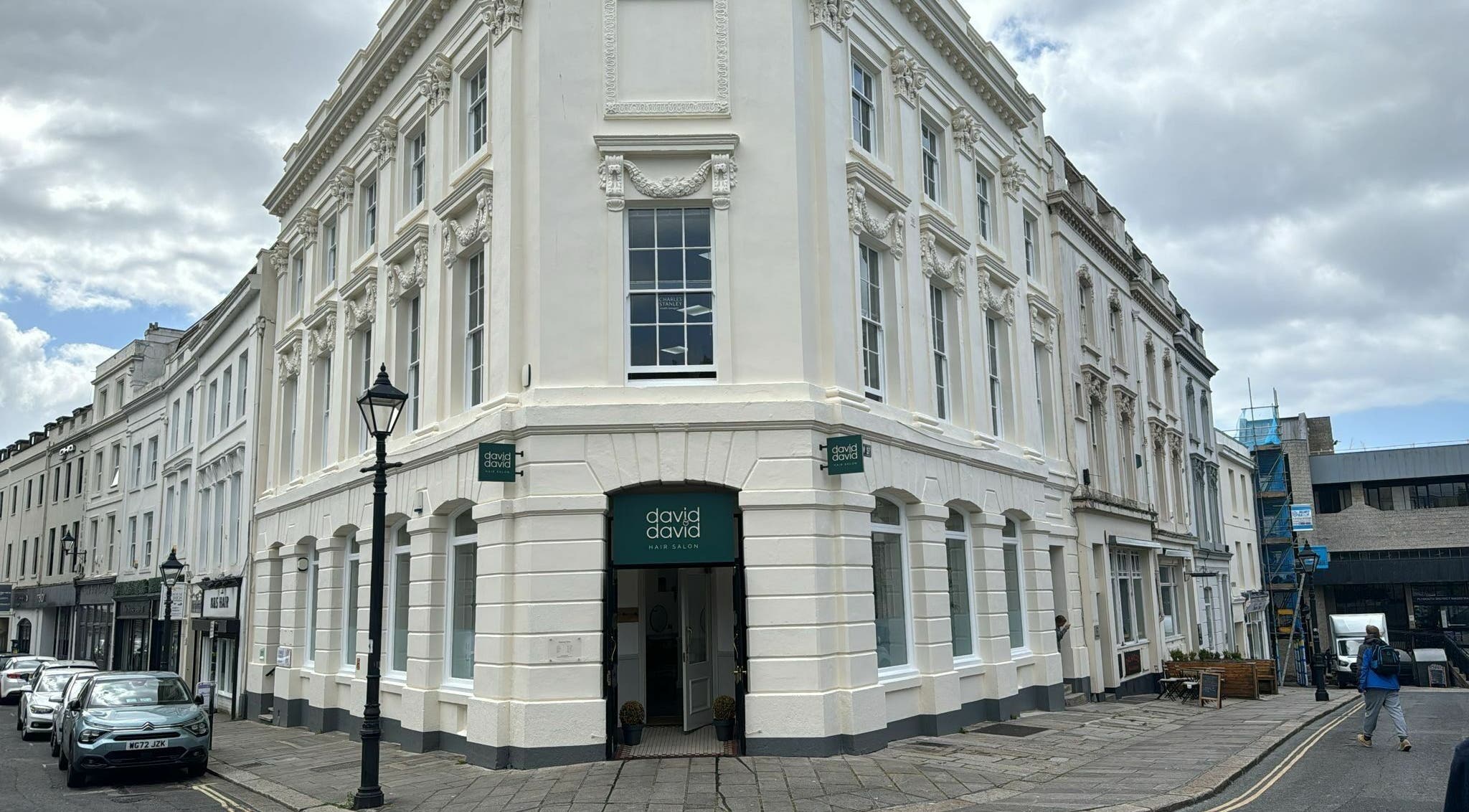 Front view of David & David beauty salon on a historic street corner in Plymouth, England, GB.