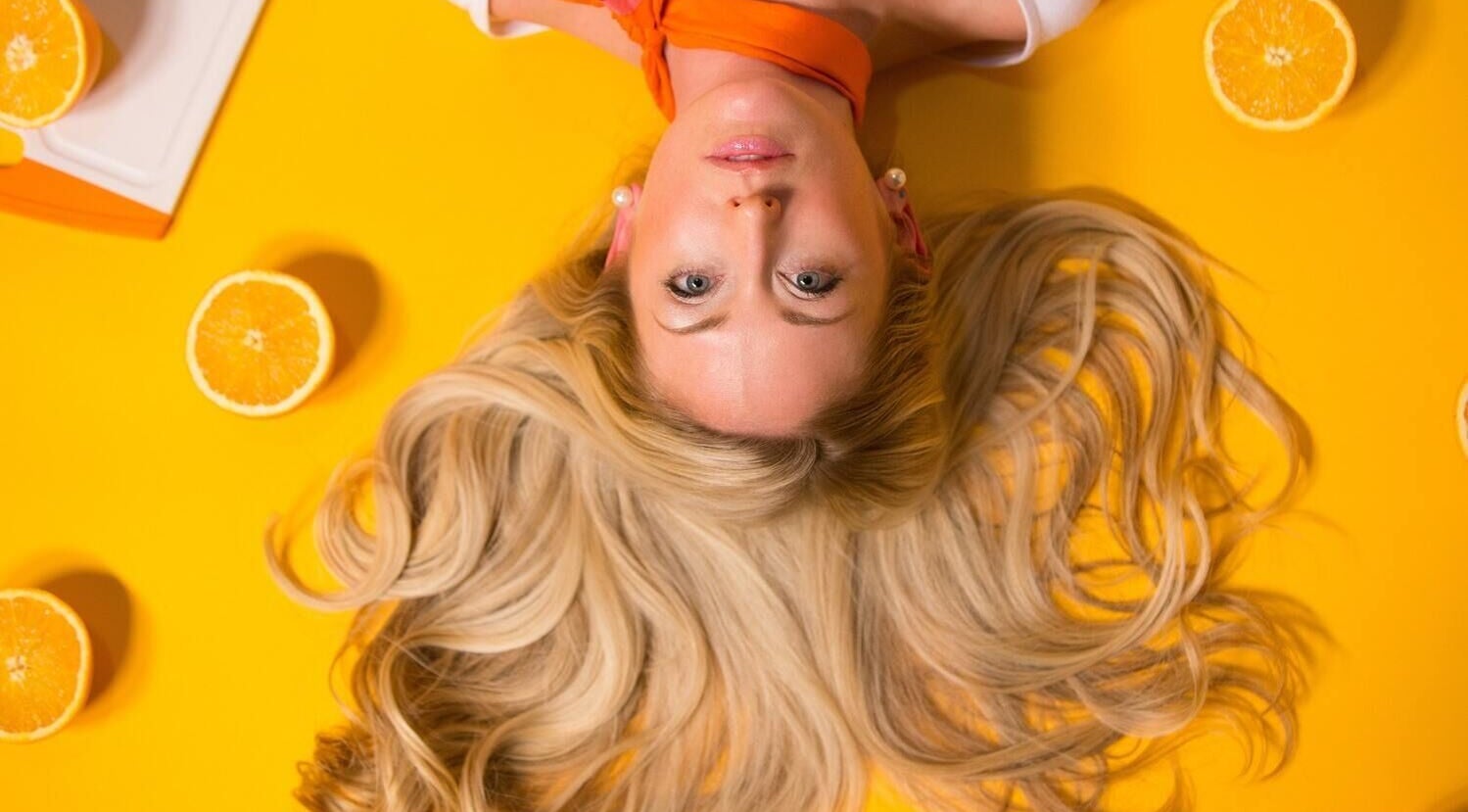 Vibrant hair styling at Salon 47 in Howlong, New South Wales, AU with citrus-themed decor.