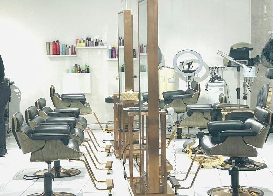 Modern interior of SK Hair Salon in Montréal, Québec, CA with stylish salon chairs and hairdressing stations.