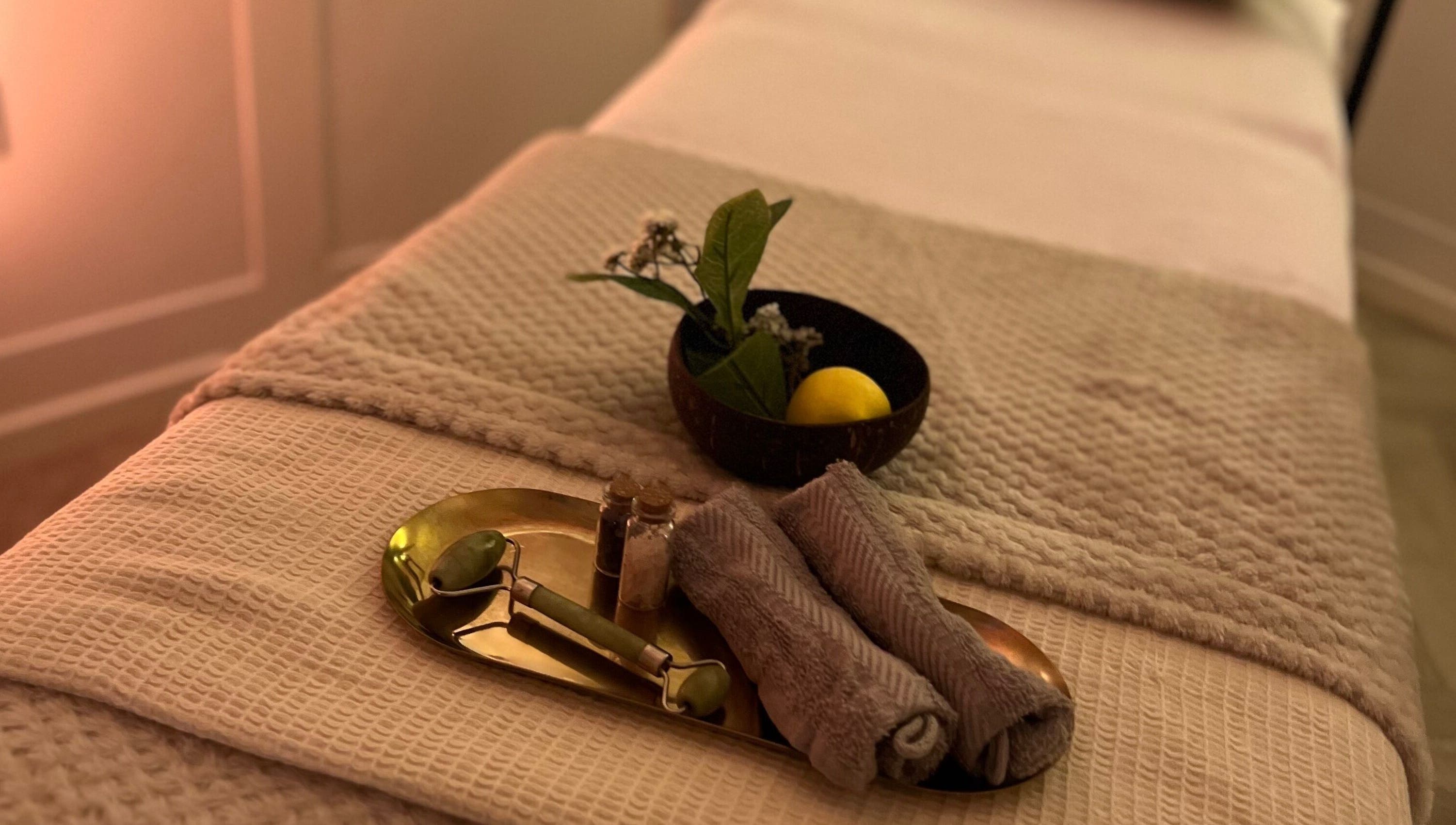 Calming therapy table at Acupuncture with Natalie, Lowestoft, England, GB, with jade roller and towels.