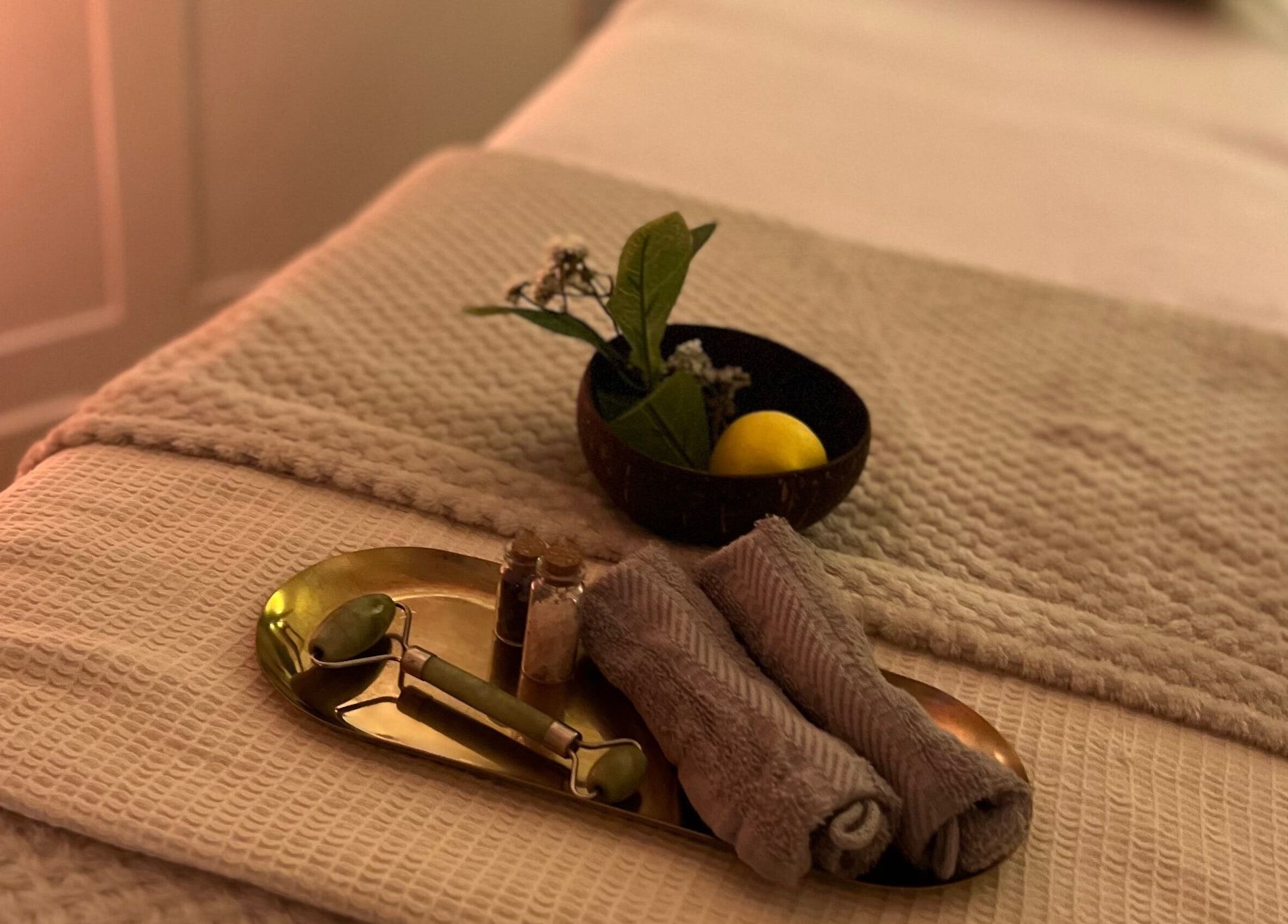 Calming therapy table at Acupuncture with Natalie, Lowestoft, England, GB, with jade roller and towels.