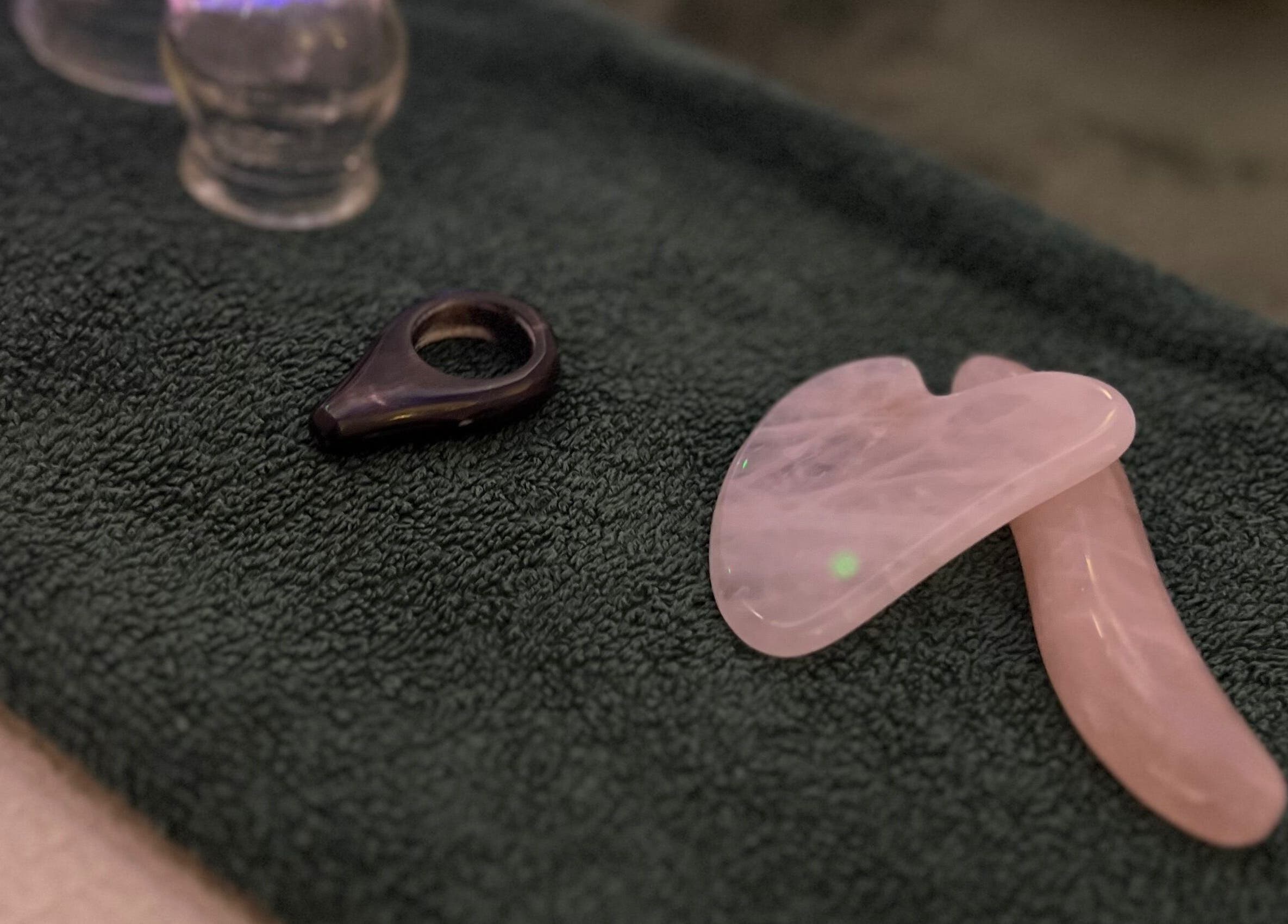 Holistic tools for wellness at Acupuncture with Natalie, Lowestoft, England, GB on dark towel.