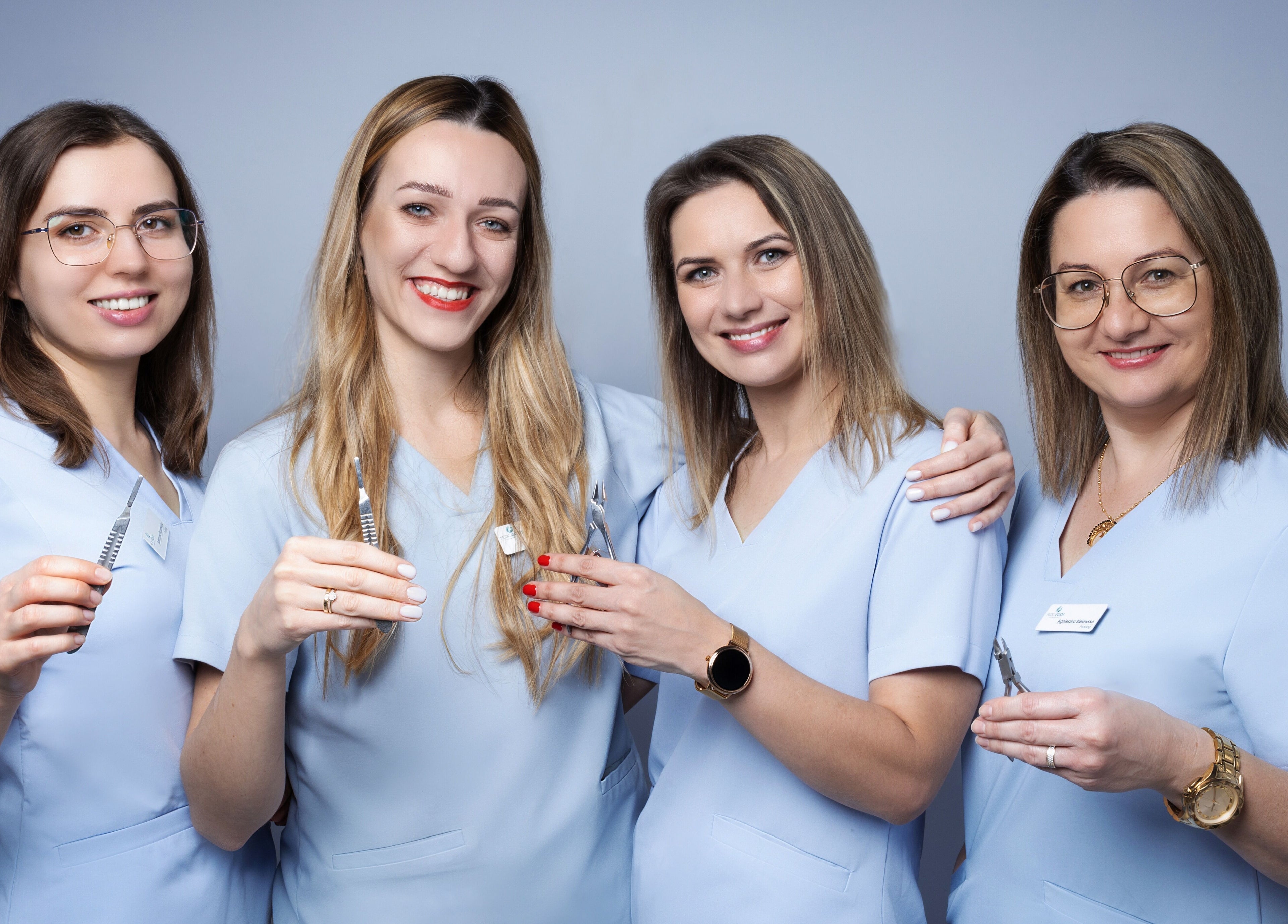 Zespół specjalistów w Medic 4 Foot Profesjonalnie Dla Stóp w Łódź, Łódzkie, PL, w strojach medycznych.