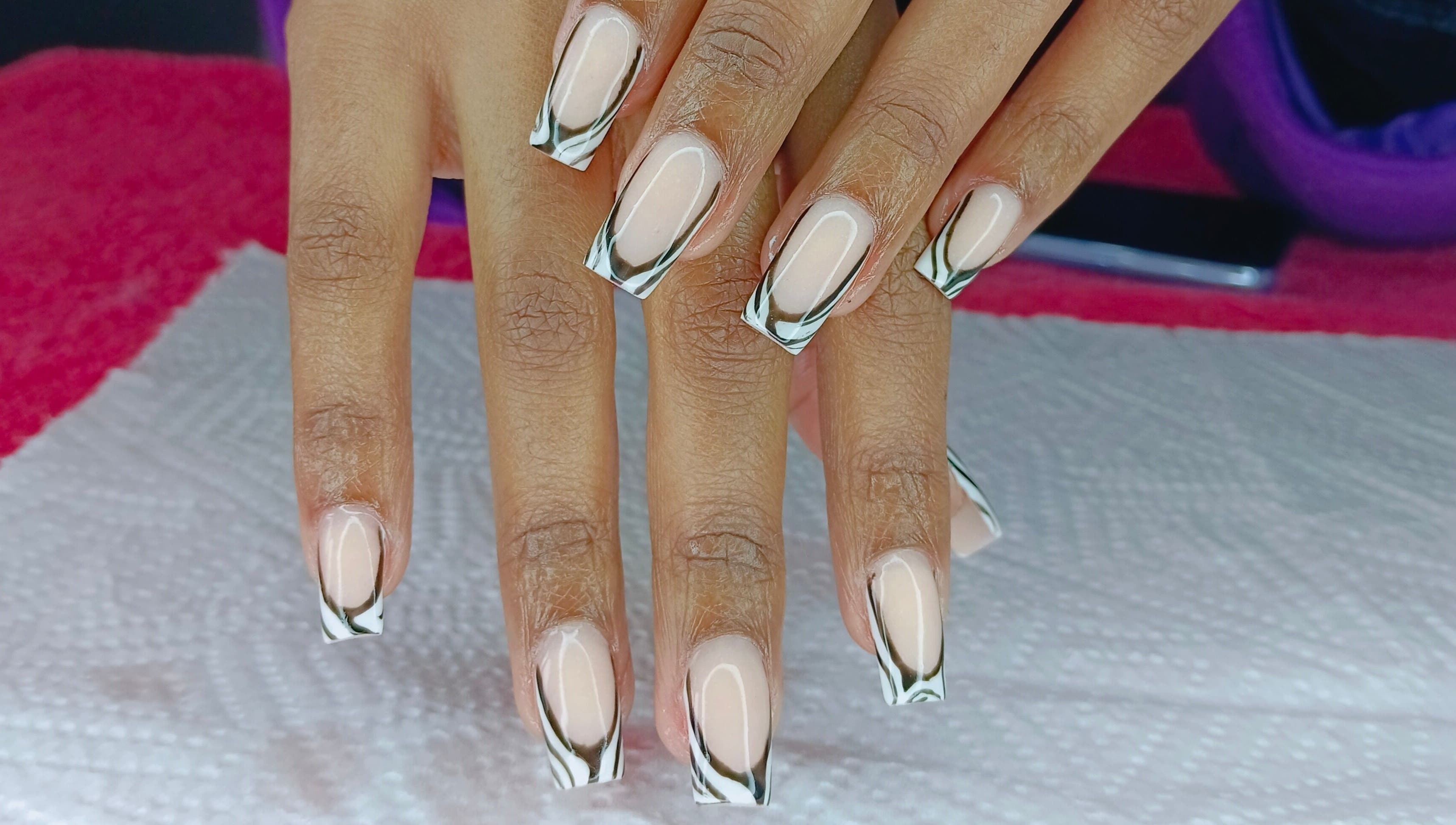 Stylish black and white French tips at Philly's Beauty Bar, Benoni, Gauteng, ZA.