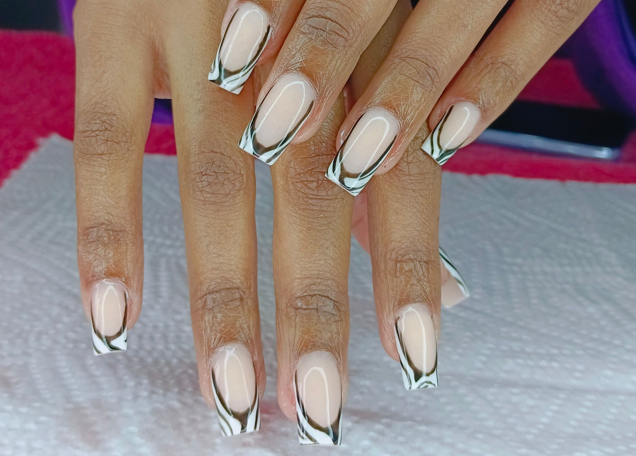 Stylish black and white French tips at Philly's Beauty Bar, Benoni, Gauteng, ZA.
