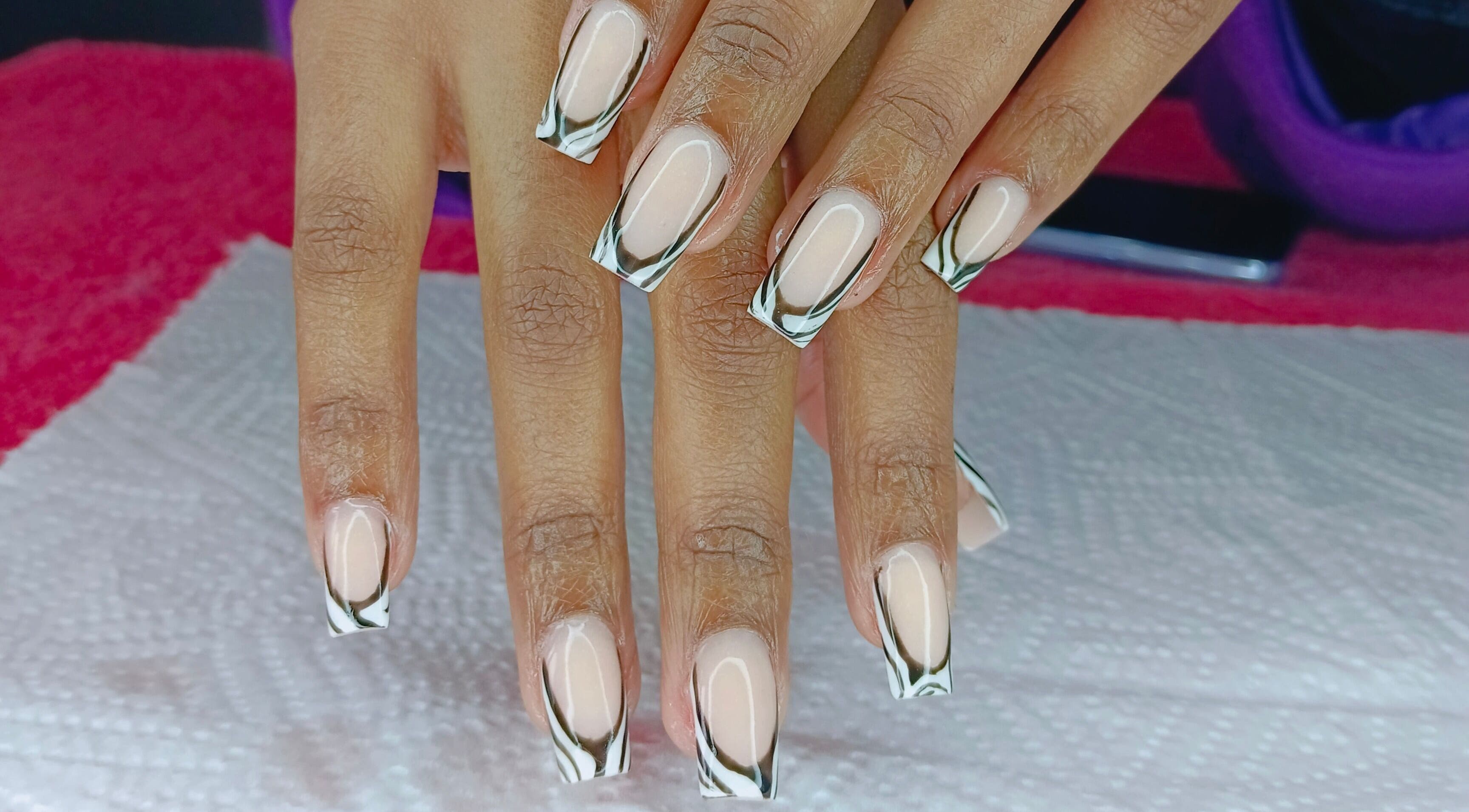 Stylish black and white French tips at Philly's Beauty Bar, Benoni, Gauteng, ZA.