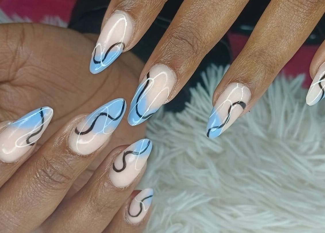 Elegant blue swirl nail art at Philly's Beauty Bar, Benoni, Gauteng, ZA. Perfect blend of style and creativity.