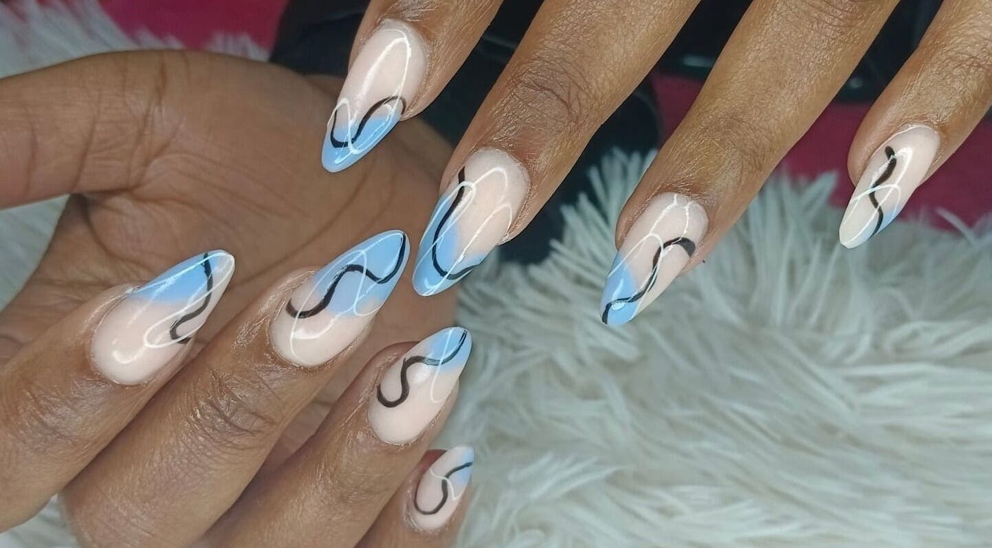 Elegant blue swirl nail art at Philly's Beauty Bar, Benoni, Gauteng, ZA. Perfect blend of style and creativity.