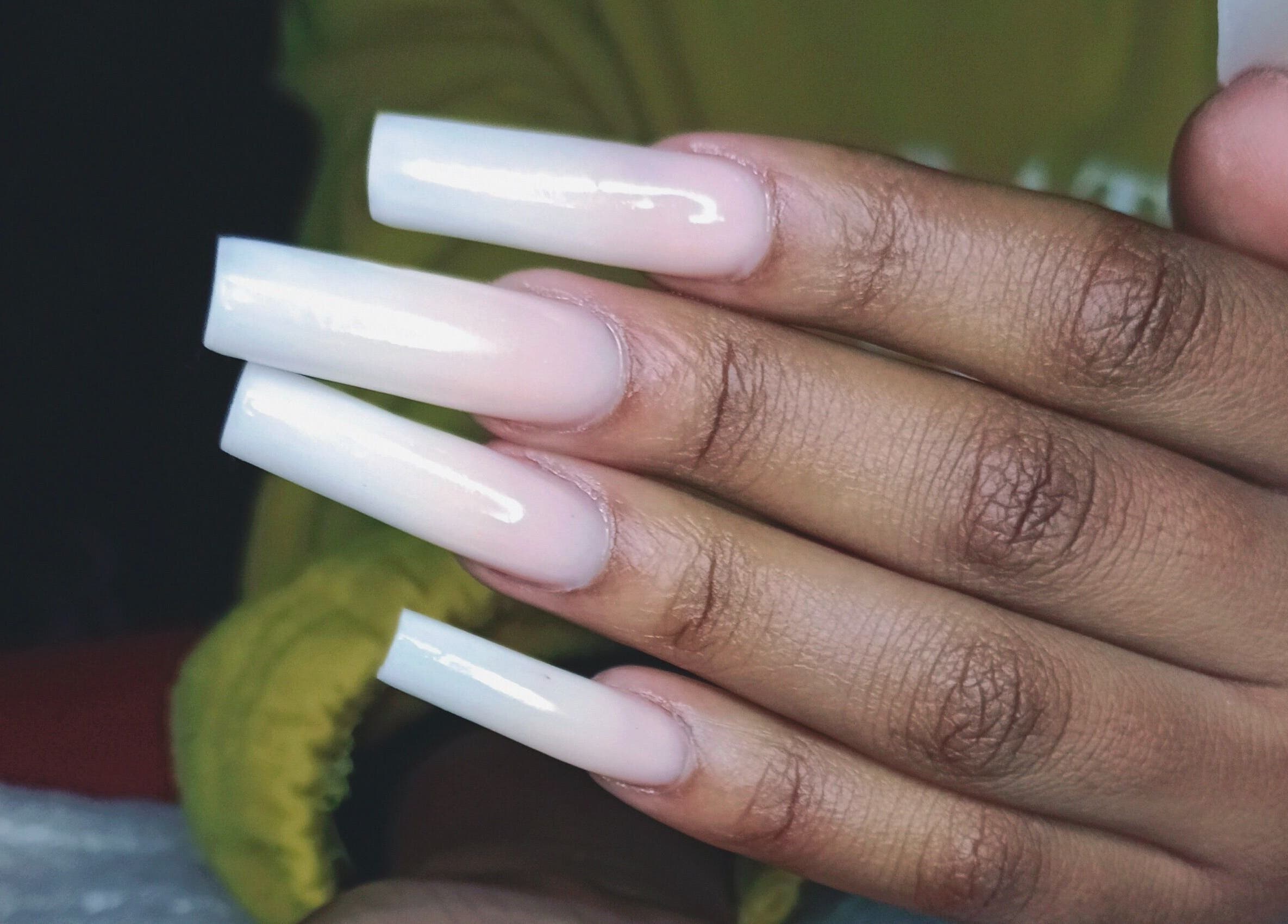 Stylish acrylic nails at Philly's Beauty Bar, Benoni, Gauteng, ZA, showcasing glossy elegance and craftsmanship.