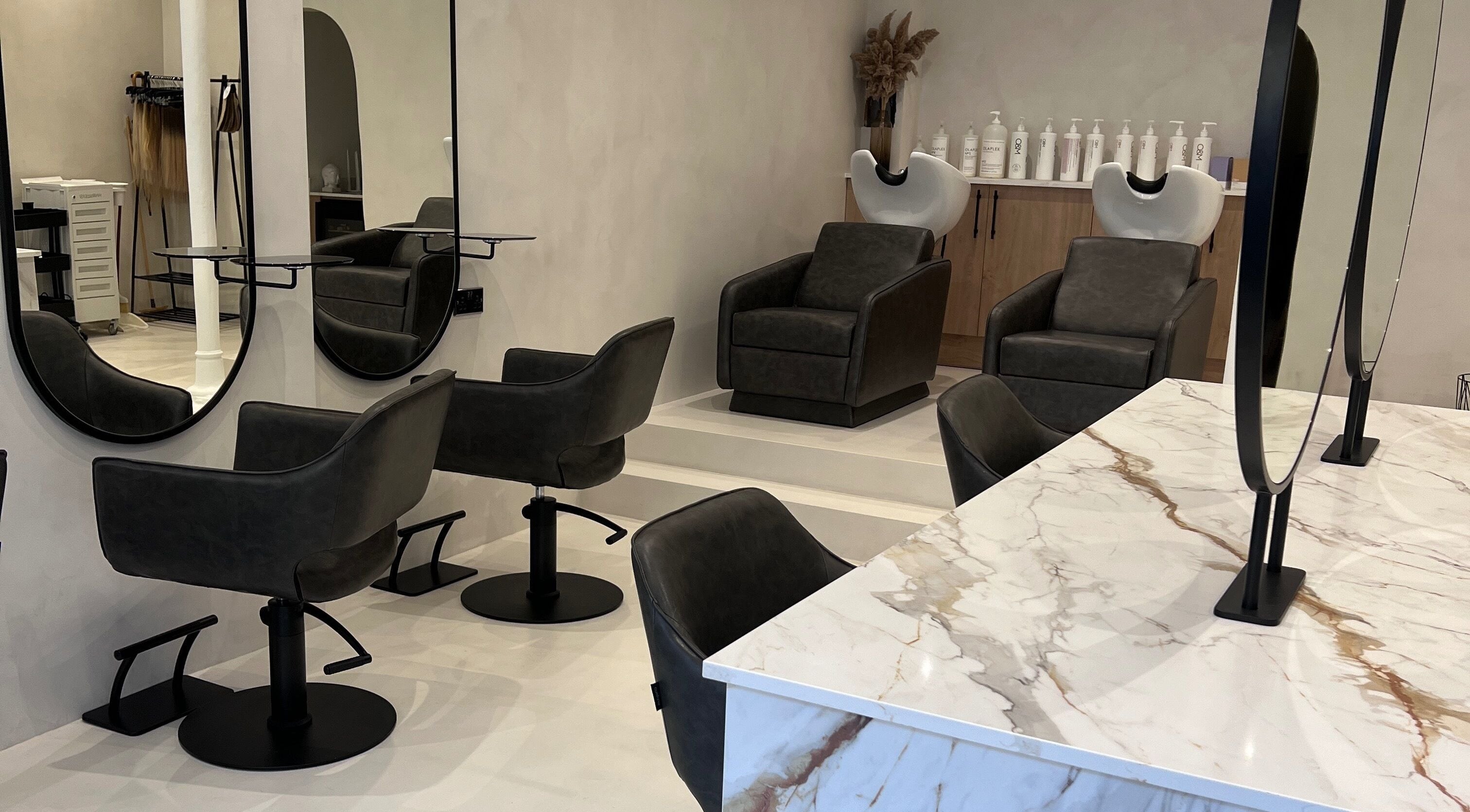 Elegant interior of Soul Salon in Bagshot, England, GB featuring modern salon chairs and sleek mirrors.