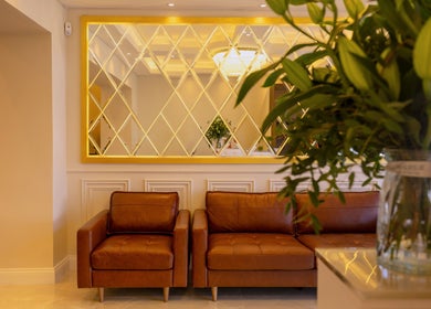 Elegant lounge area at Dolce Nails Carlow, Carlow, County Carlow, IE with leather seating and cozy decor.