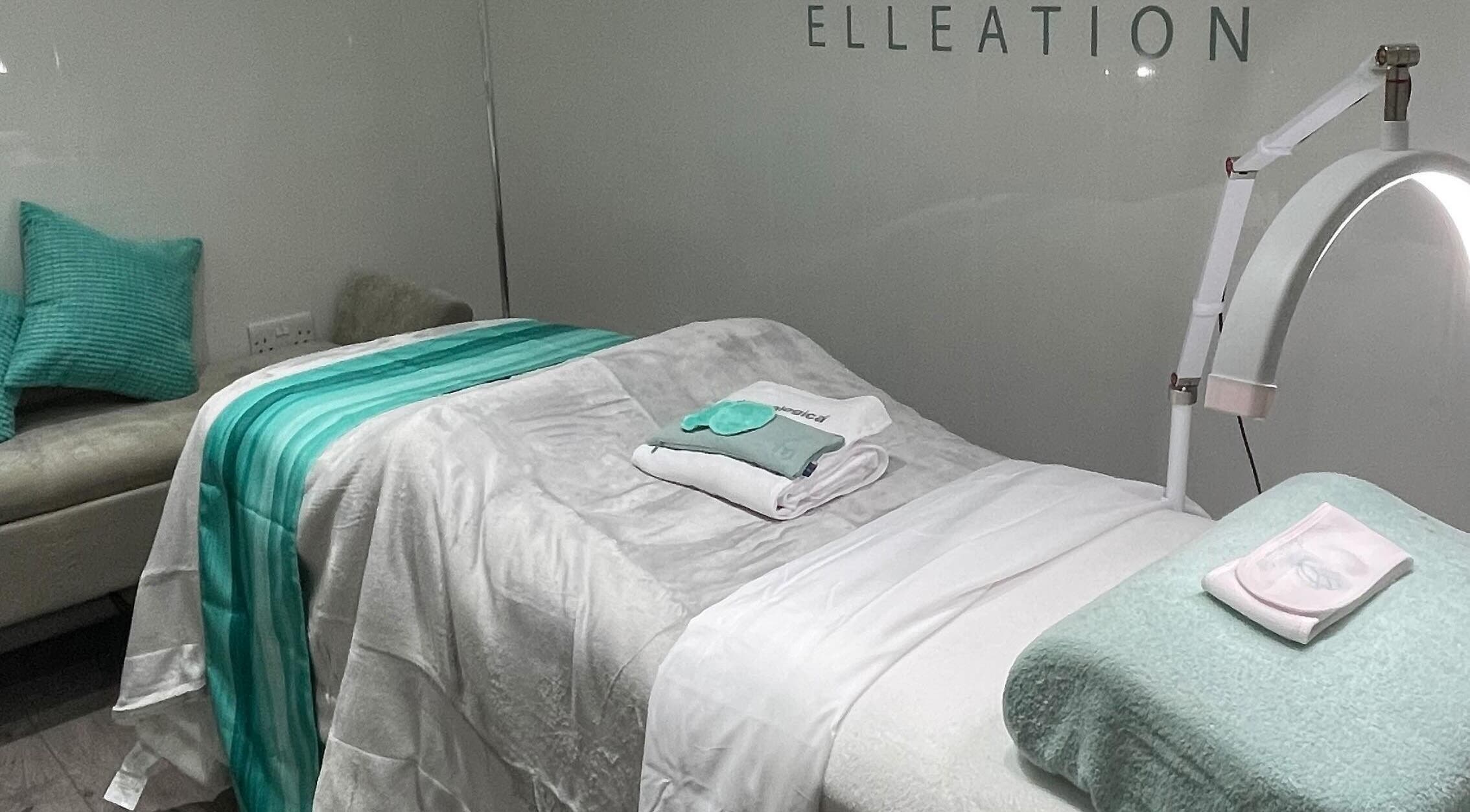 Relaxing treatment room at Facial Elleation, Banstead, England, GB, featuring a cozy bed and soft lighting.