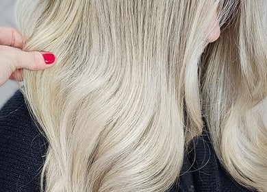 Stylish blonde waves styled at HAIRBYGINGERMTL, Montréal, Québec, CA - elegant and luxurious hair transformation.