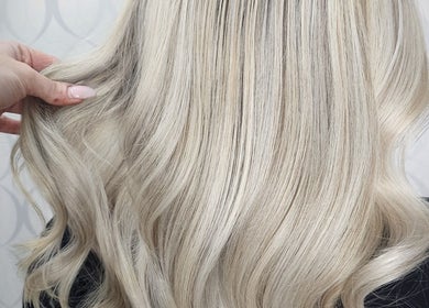 Elegant blonde waves styled at HAIRBYGINGERMTL, Montréal, Québec, CA. Perfect for a chic, modern look.