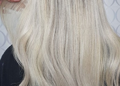 Sleek blonde hair styled at HAIRBYGINGERMTL, Montréal, Québec, CA, showcasing professional salon expertise.
