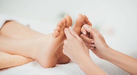 Foot massage at Eleven Thai Therapy, London, England, GB, showcasing expert relaxation techniques.