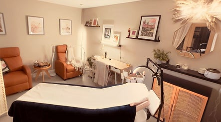 Relaxing therapy room at The Pearly Bright, Blantyre, Scotland, GB featuring cozy chairs and elegant decor.