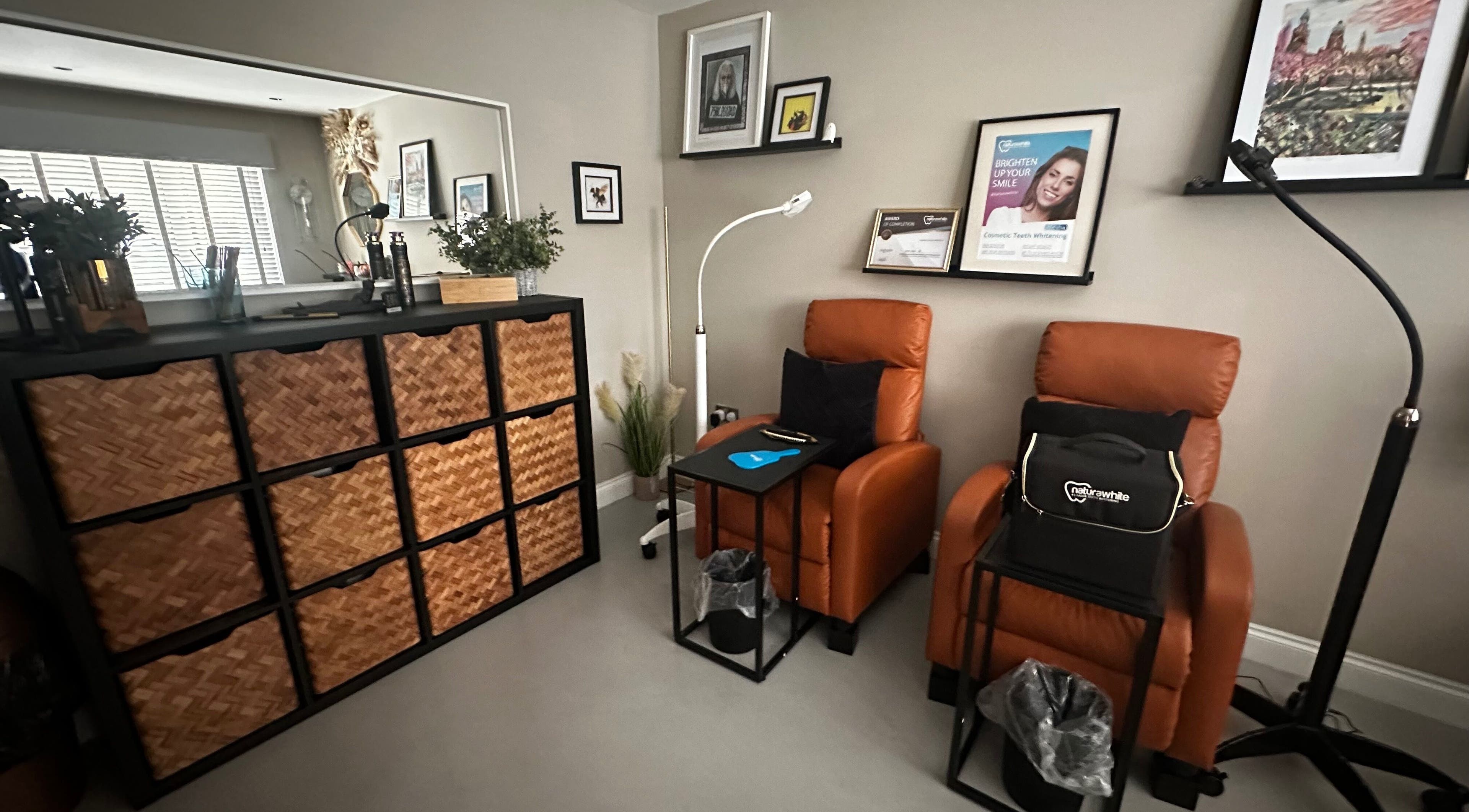 Elegant seating area at The Pearly Bright, Blantyre, Scotland, GB, featuring plush armchairs and decor.