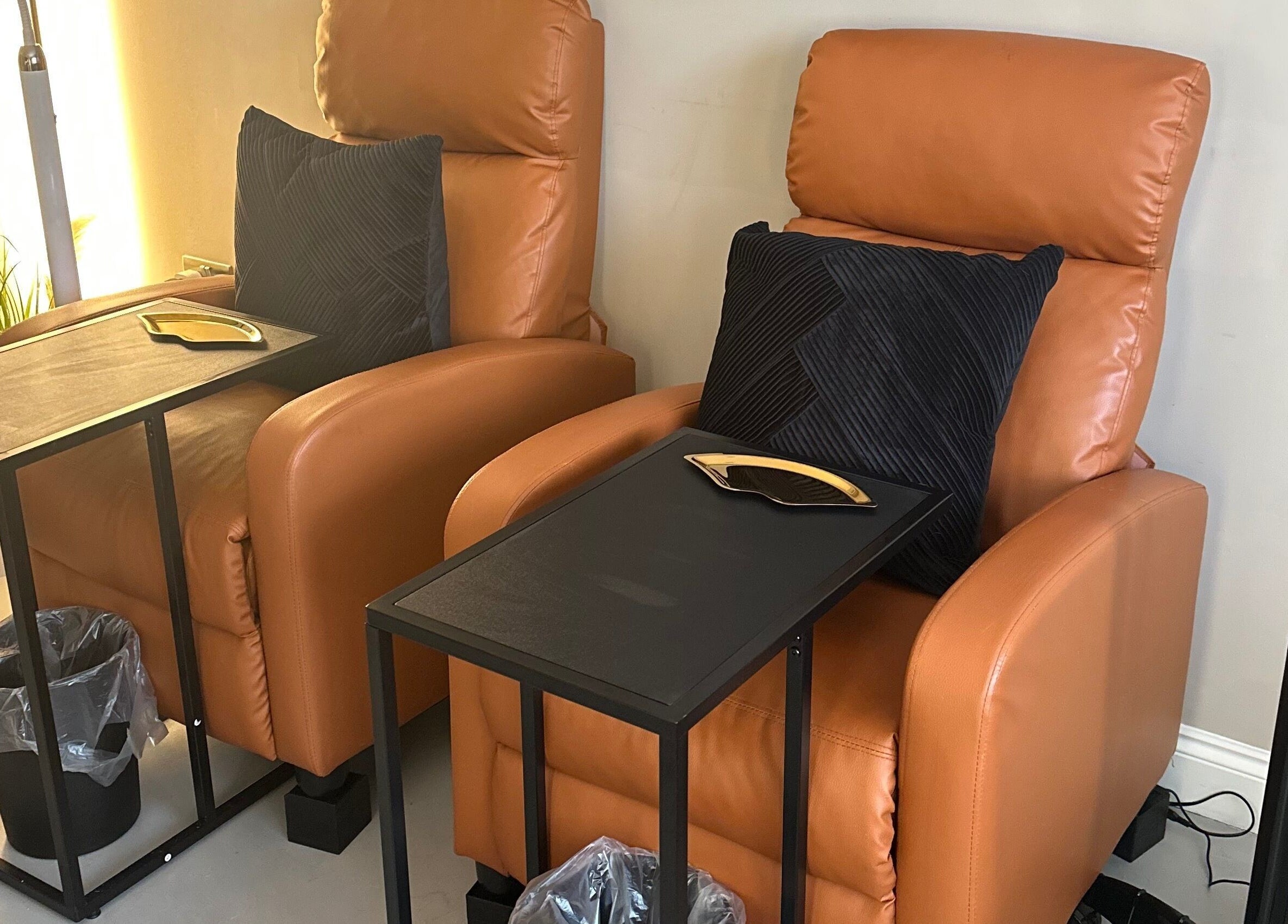 Comfortable leather chairs at The Pearly Bright, Blantyre, Scotland, GB, offering a cozy wellness experience.