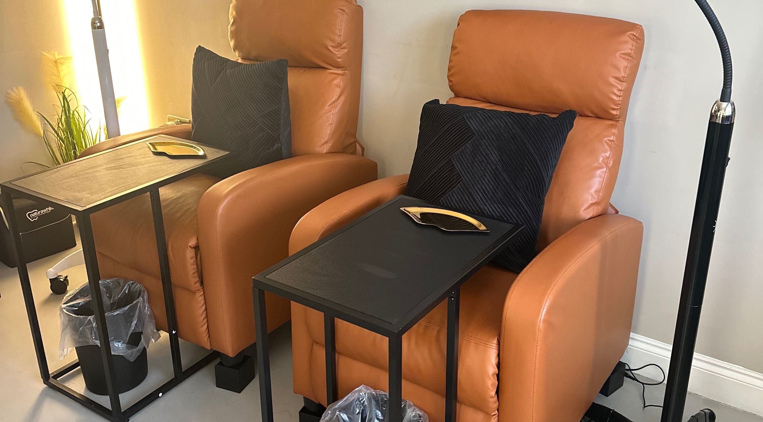 Comfortable leather chairs at The Pearly Bright, Blantyre, Scotland, GB, offering a cozy wellness experience.