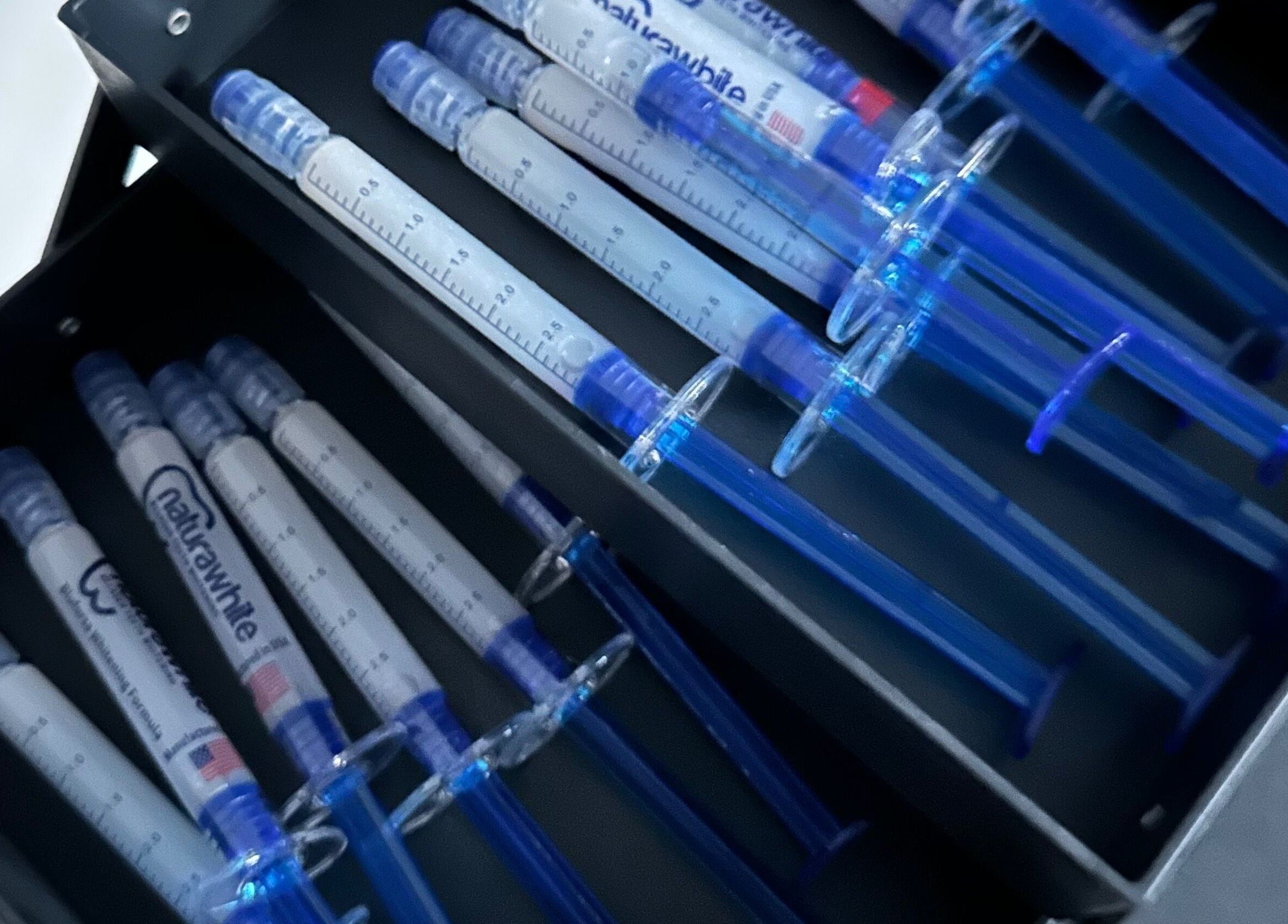 A display of syringes at The Pearly Bright in Blantyre, Scotland, GB, highlighting professional care.