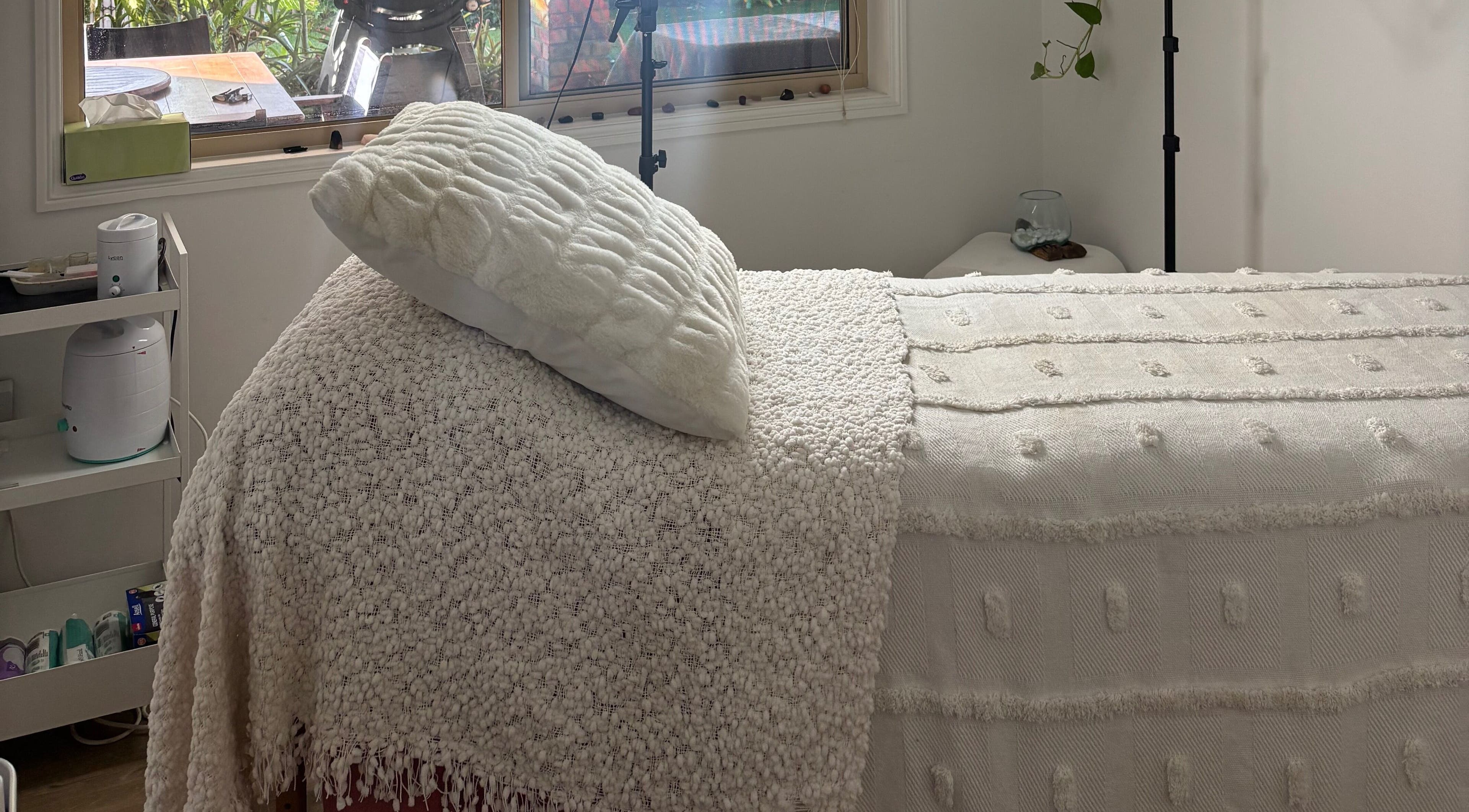 Calming massage room at Empower Her Beauté, Victoria Point, Queensland, AU with soft white linens.