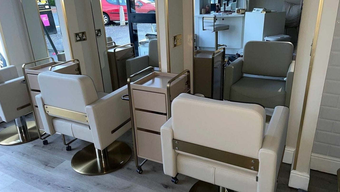 Modern salon chairs and mirrors at Salon23, Glasgow, Scotland, GB, create a chic and welcoming space.