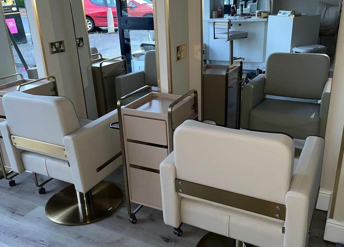 Modern salon chairs and mirrors at Salon23, Glasgow, Scotland, GB, create a chic and welcoming space.