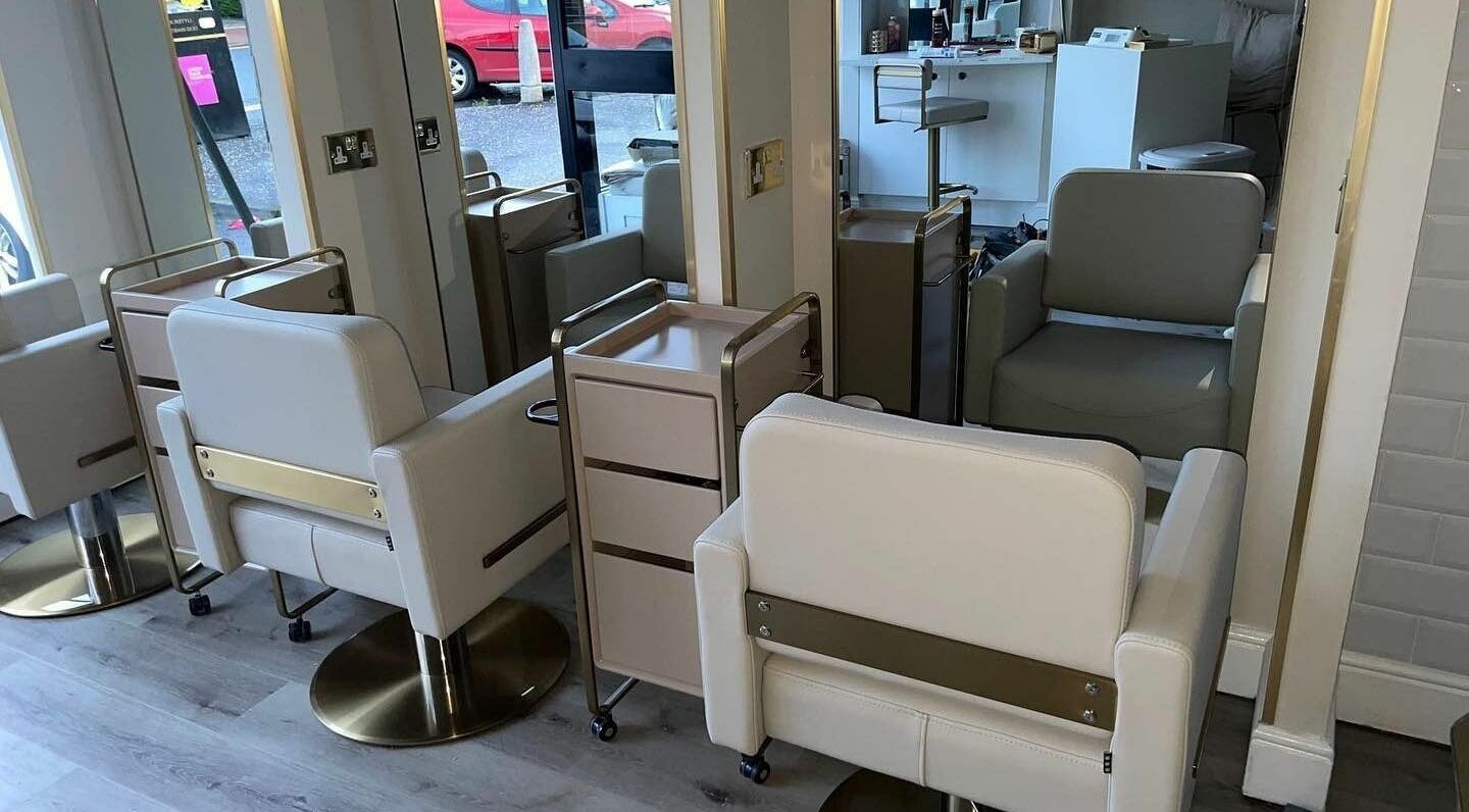 Modern salon chairs and mirrors at Salon23, Glasgow, Scotland, GB, create a chic and welcoming space.