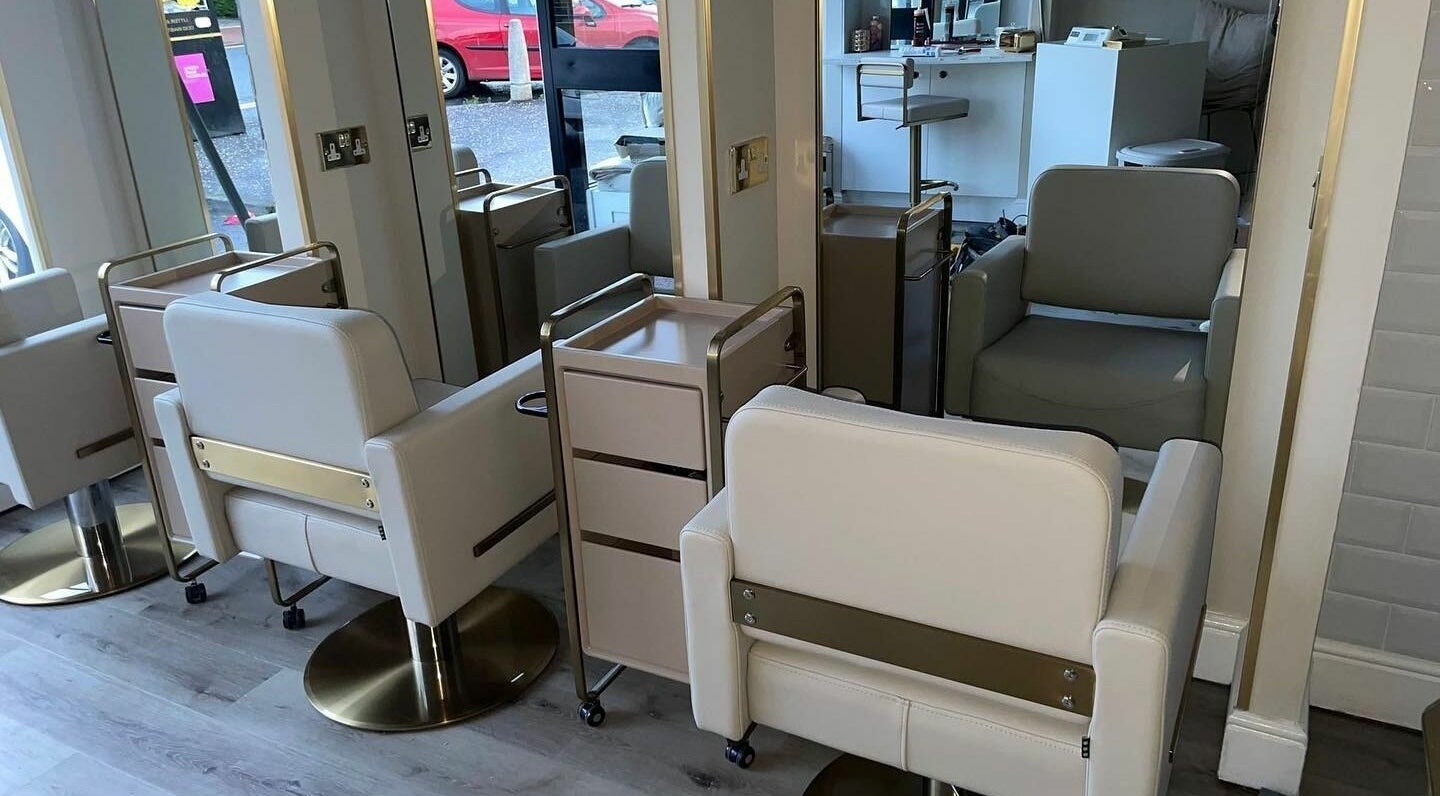 Modern salon chairs and mirrors at Salon23, Glasgow, Scotland, GB, create a chic and welcoming space.