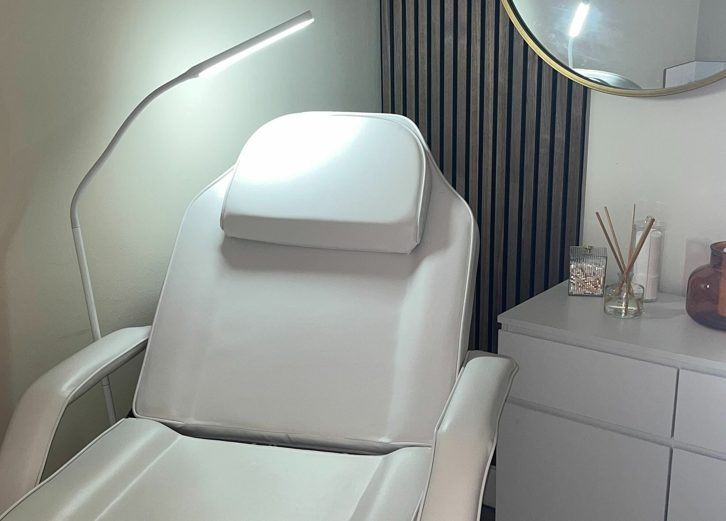 Relaxing treatment room at Salon23, Glasgow, Scotland, GB, featuring a comfortable reclining chair.