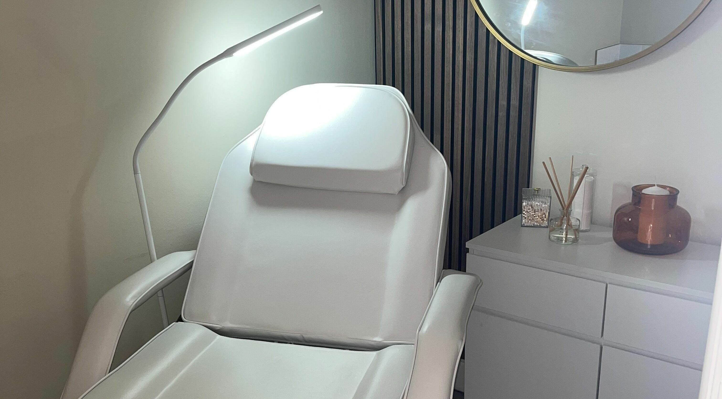 Relaxing treatment room at Salon23, Glasgow, Scotland, GB, featuring a comfortable reclining chair.