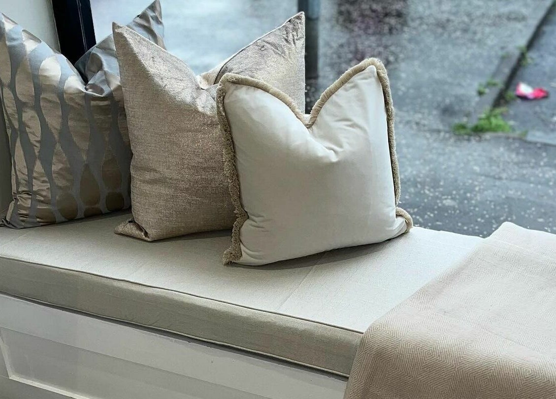 Inviting seating area with plush cushions at Salon23, Glasgow, Scotland, GB, enhancing the relaxation experience.