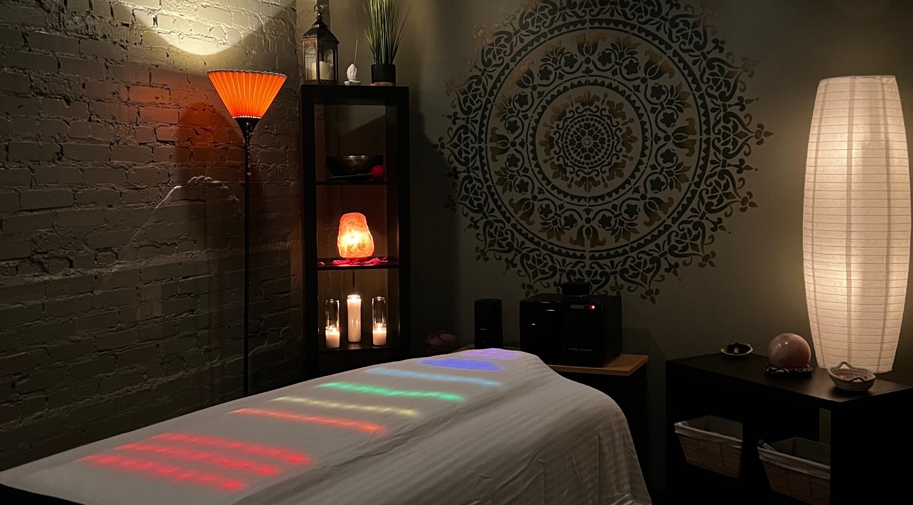 Spa room at Latisa at Oasis at the Mill, Winston-Salem, NC, US, featuring soft lighting and a massage table.