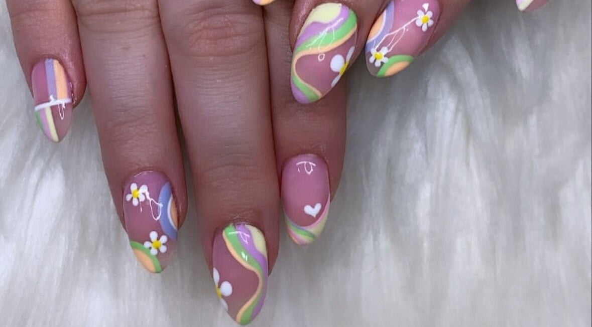 Colorful floral nail art at Beauty Box Studio, Jimboomba, Queensland, AU. Delicate flower designs and pastel swirls.