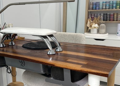 Elegant nail station at Beauty Box Studio, Jimboomba, Queensland, AU with organized supplies and sleek decor.
