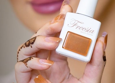 Nail polish by Freesia Beauty Center Shakhbout City in Abu Dhabi. Luxury services with elegance.