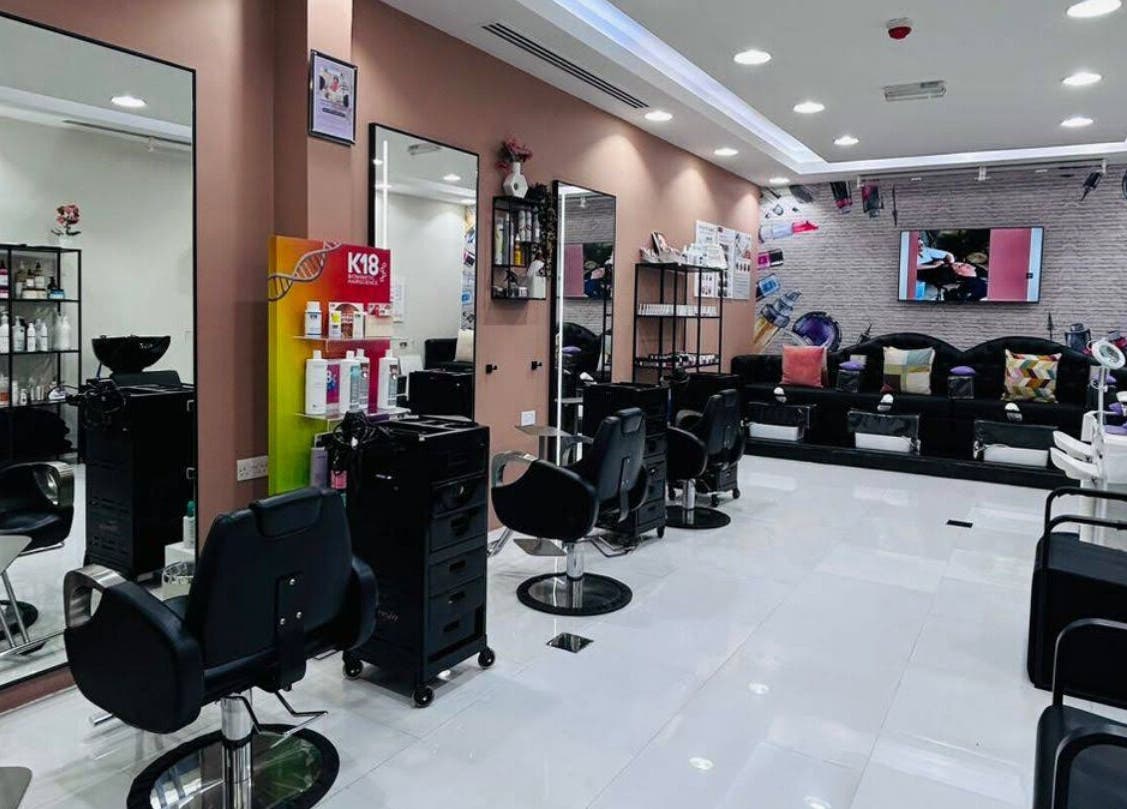 Interior view of Freesia Beauty Center - Al Falah, في الفلاح الجديدة, أبو ظبي, AE featuring modern salon setup.