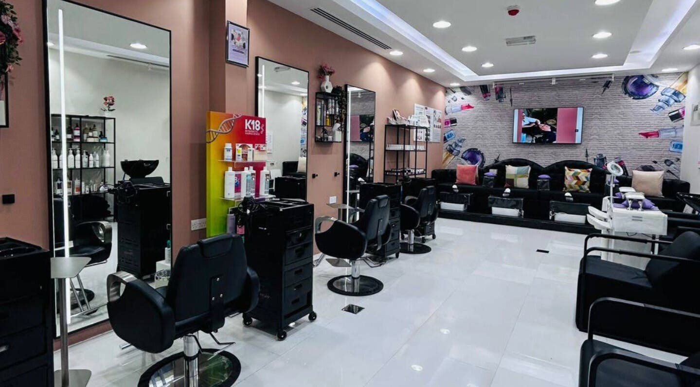 Interior view of Freesia Beauty Center - Al Falah, في الفلاح الجديدة, أبو ظبي, AE featuring modern salon setup.