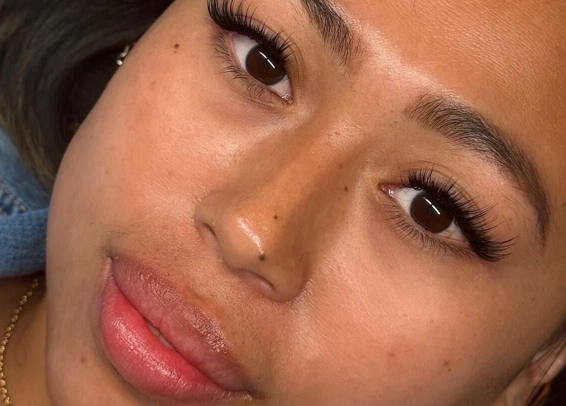 Close-up of woman's face with elegant lashes at AJade Cosmetics, Birmingham, England, GB.